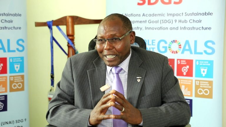 Prof. Peter Wanderi, the Principal Corporate Services at Mount Kenya University addresses journalists in his office