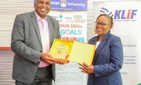 Mount Kenya University Chairman and Founder Simon Gicharu presents a token of appreciation to Dr. Monica Wanjiru Muiru, Vice Chairperson of the Ethics and Anti-Corruption Commission (EACC), during a visit by the EACC delegation to MKU.